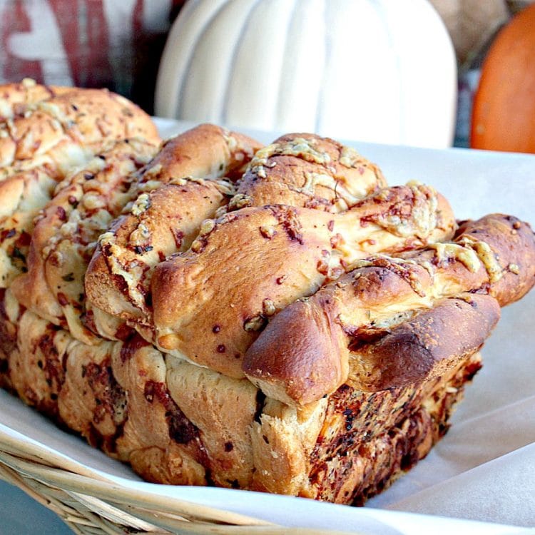 Garlic Parmesan Pull Apart Bread is a rustic, buttery loaf loaded with  flavor. It looks fancy but it could not be easier to make. No yeast or kneading to worry about  because this recipe uses frozen bread dough!