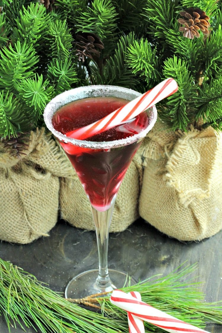 Surprise your guests by serving them a festive Pretty In Peppermint Martini! Made with Vanilla Vodka, Peppermint Schnapps and Stirrings Pomegranate Cocktail mixer, garnished with a peppermint stick! Holiday spirits never tasted so good!