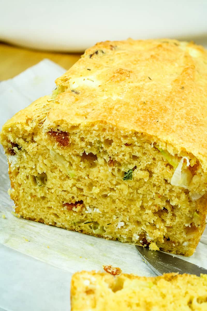 Goat Cheese Bacon Zucchini Quick Bread is a savory loaf filled with creamy goat cheese, smoky bacon and tender zucchinI. #mustlovehomecooking