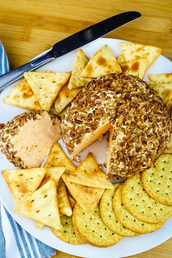 Buffalo Chicken Ranch Cheese Ball is a spicy, savory pecan coated cheese ball that was born to party! An amazing recipe that can easily be made ahead of time.