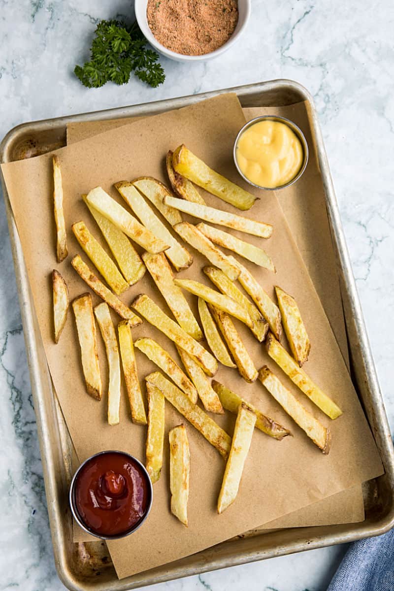 Air Fryer French Fries are a delicious way to enjoy hot and fresh fries at home. Fast and easy with little to no oil! #mustlovehomecooking