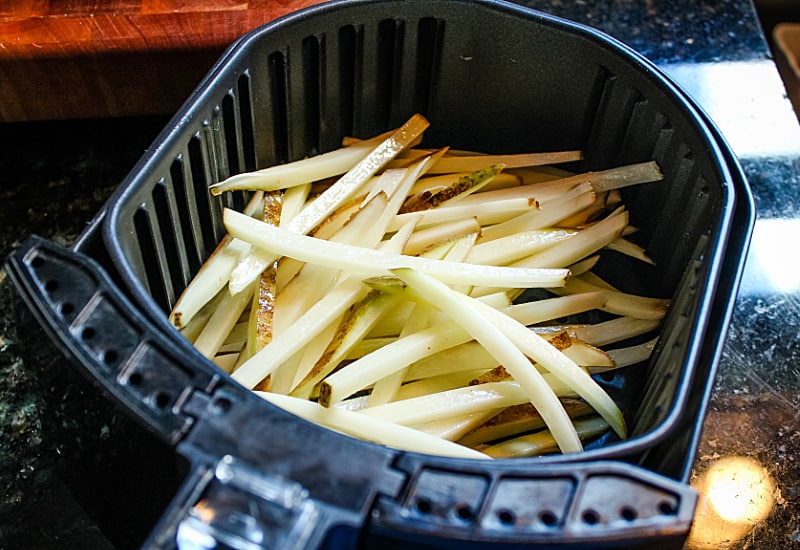 Air Fryer French Fries are a delicious way to enjoy hot and fresh fries at home. Fast and easy with little to no oil! #mustlovehomecooking