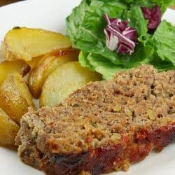 Classic Meatloaf - All seasoned and sauced up, this Southern meatloaf recipe uses celery, green onions, a bit of garlic and chili sauce for incredible flavor. This no-fail, kid approved recipe is sure to become a family favorite.