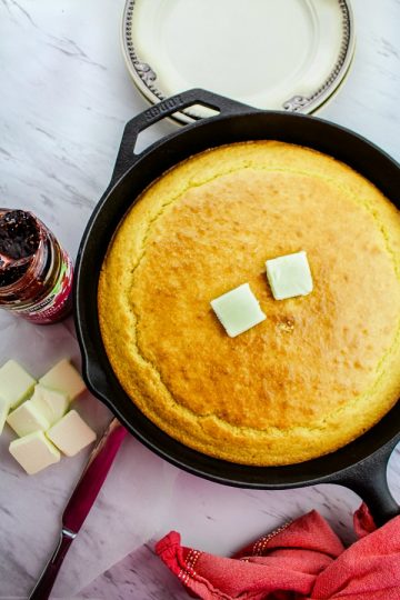 Moist and fluffy Easy Skillet Cornbread Recipe is soft on the inside with a deliciously crisp crust, this recipe is a keeper.