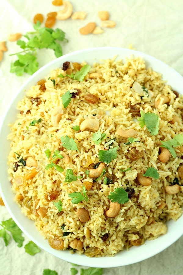 Red Curry Rice with Raisins and Cashews recipe is a quick, easy and spicy vegan meal.