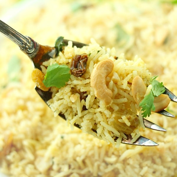 Red Curry Rice with Raisins and Cashews recipe is a quick, easy and spicy vegan meal.