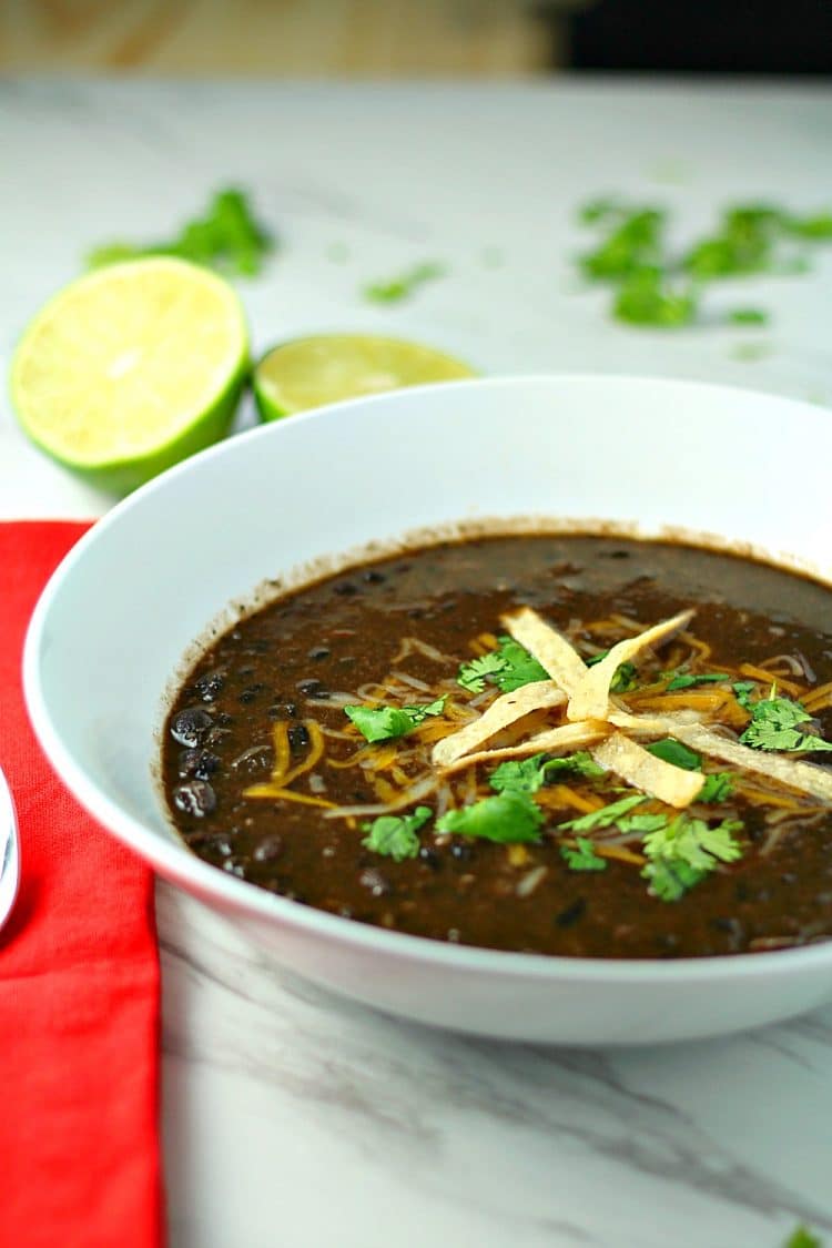 Spicy and delicious, this hearty, vegetarian Tequila Black Bean Soup takes BOLD flavor to the next level.  Loaded with Chipotle Peppers in Adobo, jalapeno peppers and real black beans, this soup is a perfect side dish for tacos, burritos and quesadillas, or it can be a meal in itself.  Make the soup even more fabulous by topping with tortilla strips, cheese, cilantro and lime wedges!