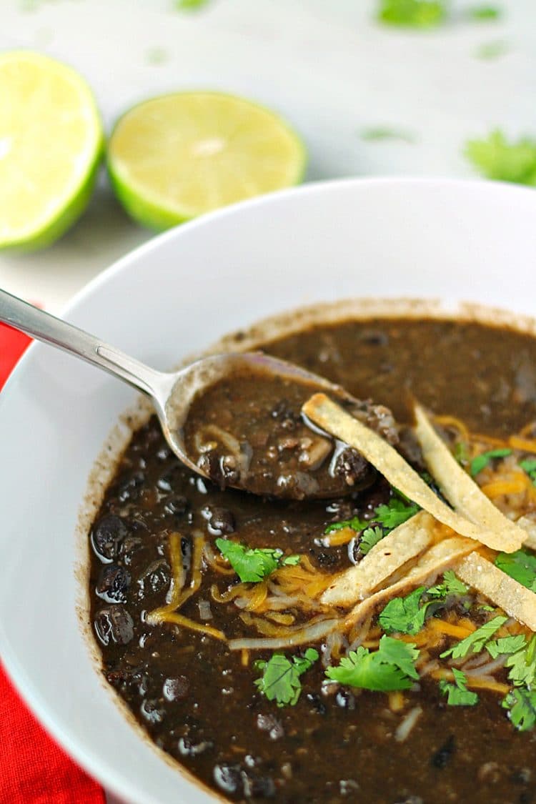 Spicy and delicious, this hearty, vegetarian Tequila Black Bean Soup takes BOLD flavor to the next level.  Loaded with Chipotle Peppers in Adobo, jalapeno peppers and real black beans, this soup is a perfect side dish for tacos, burritos and quesadillas, or it can be a meal in itself.  Make the soup even more fabulous by topping with tortilla strips, cheese, cilantro and lime wedges!