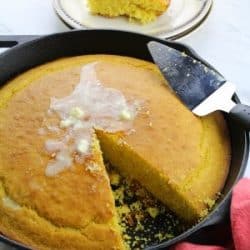 Whip up this moist and fluffy Easy Cornbread Recipe and leave your regular bread or biscuits behind. Soft on the inside with a deliciously crisp top crust, this recipe is a keeper.