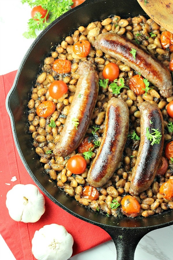 Italian Sausage Bean and Tomato Bake is a weeknight winner with crackling sausage, northern beans, juicy tomatoes and Italian seasoning.