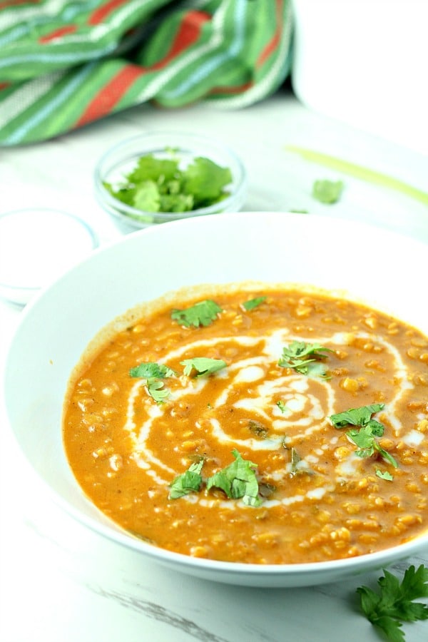 Curry Lentil Coconut Soup is a vegetarian delight! Red Lentils, coconut and ginger give this easy soup amazing flavor.