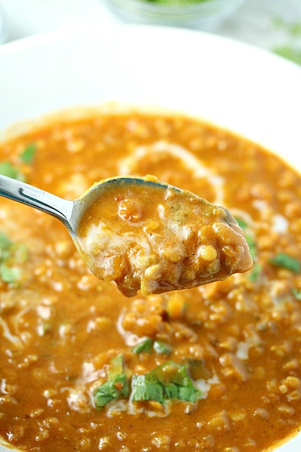 Curry Lentil Coconut Soup is a vegetarian delight! Red Lentils, coconut and ginger give this easy soup amazing flavor.