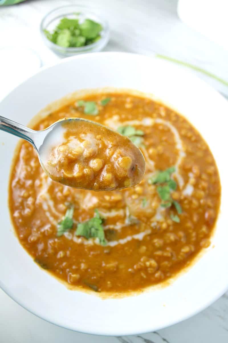 Curry Lentil and Coconut Soup with added zest from tomato, garlic, onion and ginger is a vegetarian delight! Even meat lovers are raving! #mustlovehomecooking