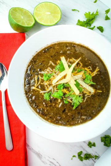 Spicy and delicious, this hearty vegetarian Tequila Black Bean Soup takes BOLD flavor to the next level. Loaded with chipotle peppers in adobo, jalapeno peppers, black beans and a splash of Tequila it's perfect on it's own or a side for tacos, burritos and quesadillas.