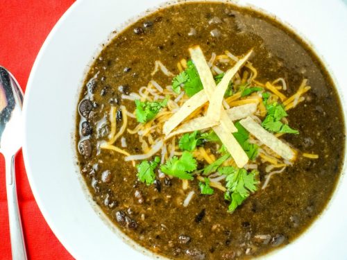 Spicy and delicious, this hearty vegetarian Tequila Black Bean Soup takes BOLD flavor to the next level. Loaded with chipotle peppers in adobo, jalapeno peppers, black beans and a splash of Tequila it's perfect on it's own or a side for tacos, burritos and quesadillas.