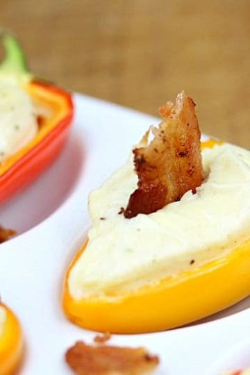 Bacon Ranch Mini Pepper Popper - the perfect little appetizer. A sweet mini bell pepper, stuffed with ranch spiked cream cheese then topped with a bite of crispy bacon!