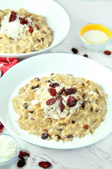 Slow Cooker Cranberry Coconut Oatmeal is made with creamy coconut milk, steel cut oats, chewy dried cranberries, brown sugar and pie spice.