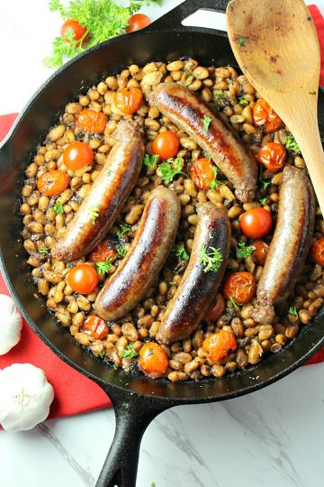 Italian Sausage Bean and Tomato Bake with crackling sausage, creamy northern beans, tomatoes and Italian seasoning can be on your dinner table in under 30 minutes!