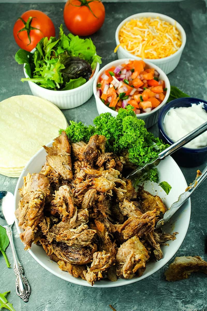 Crispy Pork Carnitas are baked low and slow until fall apart delicious, then finished under the broiler so the edges are caramelized and extra crisp. #mustlovehomecooking