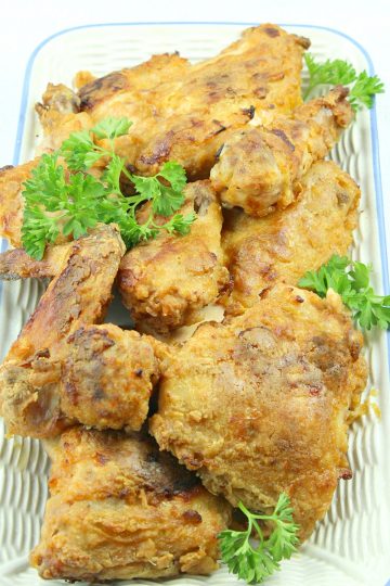 Buttermilk Oven Fried Chicken is a spicy, crunchy and healthier way to satisfy your fried chicken cravings but with no oil spatter. It's crispy and moist right from the oven!