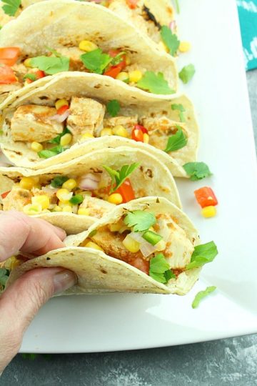 Slow Cooker Habanero Chicken Tacos - Piled high with chunks of juicy chicken and corn salsa, they are a smoldering treat for the taste buds!