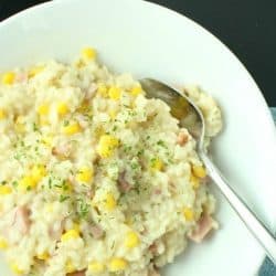 creamy ham and corn risotto on plate