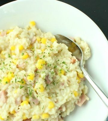 creamy ham and corn risotto on plate