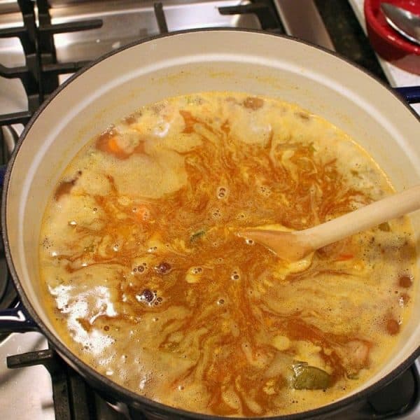 Three Bean Ham Soup simmering in pot