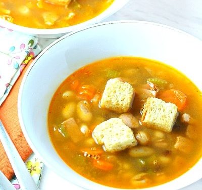Three Bean Ham Soup in white bowl
