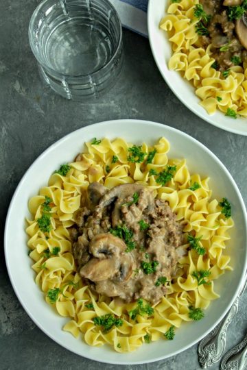 Easy Savory Beef Stroganoff Recipe is so simple to make and ready in under 30 minutes. A creamy and delicious recipe you'll want in your dinnertime rotation!