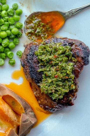 Smoky Chimichurri Sauce is the perfect way to add zesty, smoked flavor to your beef, chicken or pork! Made with fresh parsley, smoked paprika, oregano, garlic, red pepper flakes, olive oil and vinegar, it is a quick and tasty addition to any meal.