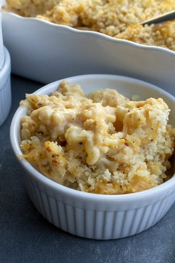 Swap out the carbs in this healthier version of Cauliflower Mac and Cheese. So creamy and cheesy, this dish is just as tasty without the pasta.