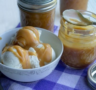 peanut butter ice cream sauce on ice cream and in a jar with spoon