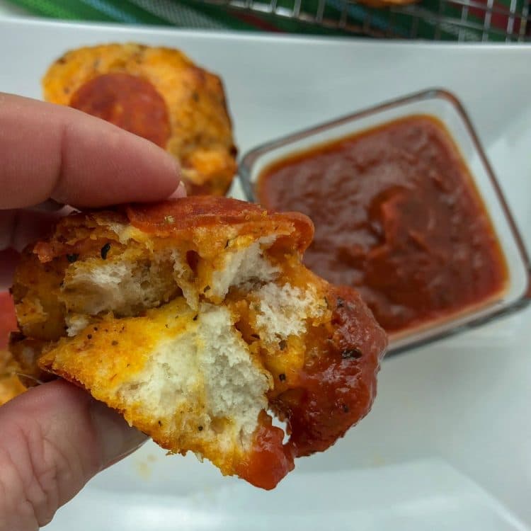 pizza popper dipped in sauce