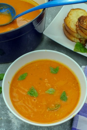 Roasted Tomato Soup - fresh, smooth and full of incredibly concentrated flavor from sheet-pan roasting the tomatoes, vegetables and garlic.