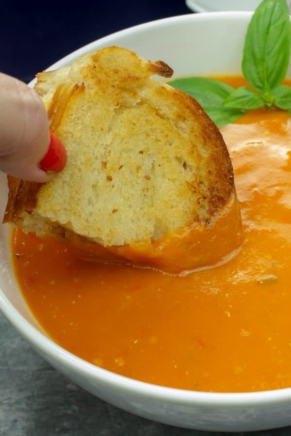Roasted Tomato Soup - fresh, smooth and full of incredibly concentrated flavor from sheet-pan roasting the tomatoes, vegetables and garlic.