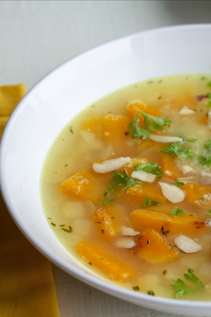 Savory Butternut Squash Bean Soup is a savory protein-packed blend of butternut squash, white beans, chickpeas and couscous. Warm, comforting and so tasty this will be a favorite family soup.