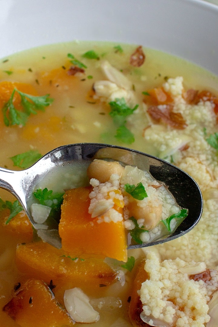 Savory Butternut Squash Bean Soup is a savory protein-packed blend of butternut squash, white beans, chickpeas and couscous. Warm, comforting and so tasty this will be a favorite family soup.