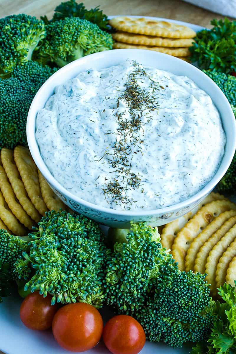 Simple and refreshing, this creamy dill dip is party ready in just minutes. Dill dip is perfect served with your favorite chips, crackers and fresh chopped veggies! #mustlovehomecooking