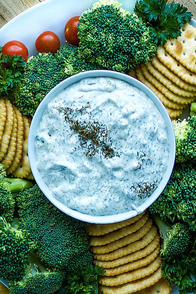 Simple and refreshing, this creamy dill dip is party ready in just minutes. Dill dip is perfect served with your favorite chips, crackers and fresh chopped veggies! #mustlovehomecooking