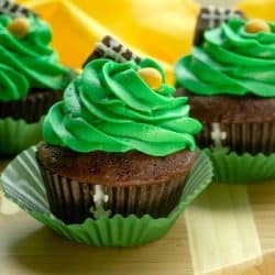 Easy Candy Football Cupcakes are chocolate cake, topped with rich buttercream frosting. Decorated with candies, these cupcakes are perfect for game day parties and tailgating!