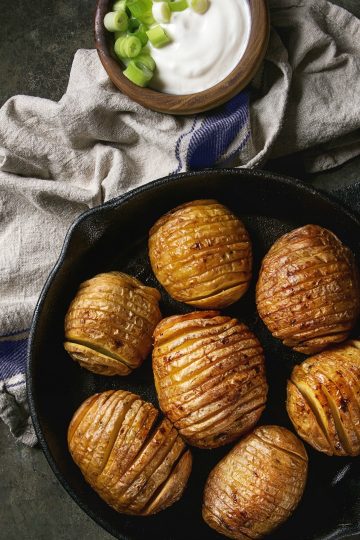 Easy Baked Hasselback Potatoes are tender, crispy sliced potatoes dripping with butter and herbs.