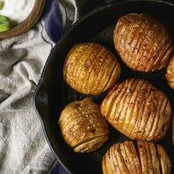 baked hasselback potatoes in cast iron skillet