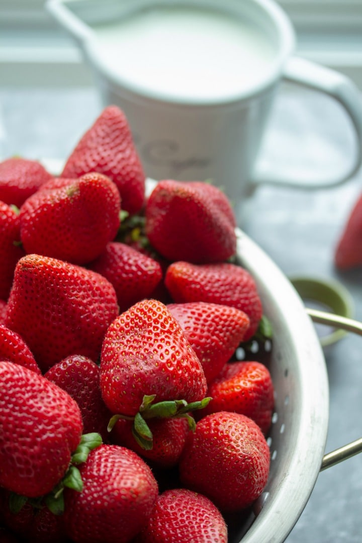 Whole ripe strawberries in colander