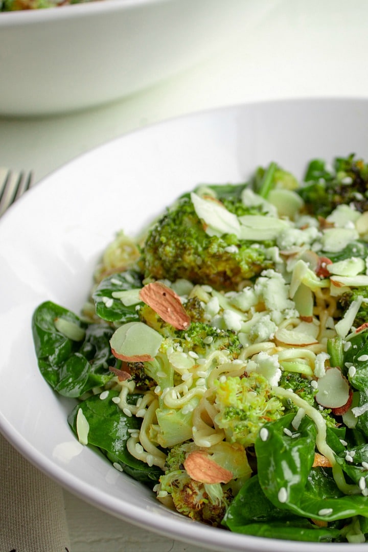 Cold Noodle Broccoli Spinach Salad is a tasty blend of ramen noodles, roasted fresh broccoli and spinach, tossed in a light vinaigrette. Full of vitamins and fiber, this flavorful dish tastes good is good for you, too!