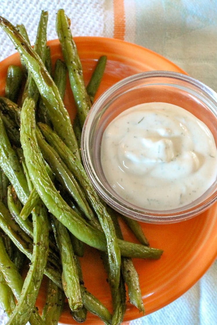 Zesty Green Bean Dippers are oven roasted, spicy green beans roasted in the oven until crispy, served with fat-free dill dip! Only 38 calories a serving, including dip!