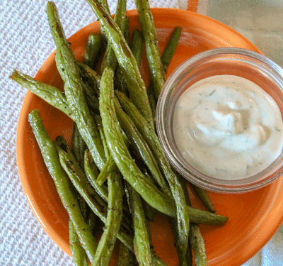 Zesty Green Bean Dippers are oven roasted, spicy green beans roasted in the oven until crispy, served with fat-free dill dip! Only 38 calories a serving, including dip!