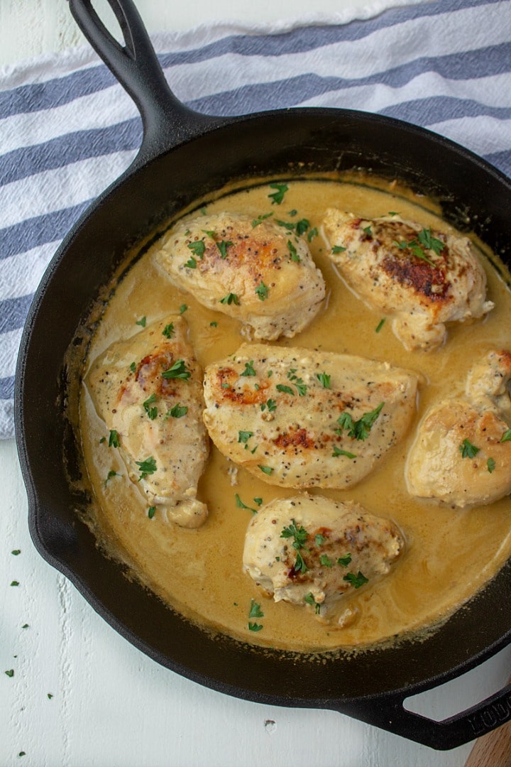 Make this Creamy French Mustard Chicken - juicy sauteed chicken breasts with an easy, tangy sauce made with two kinds of mustard and real cream! Great on pork and seafood too!