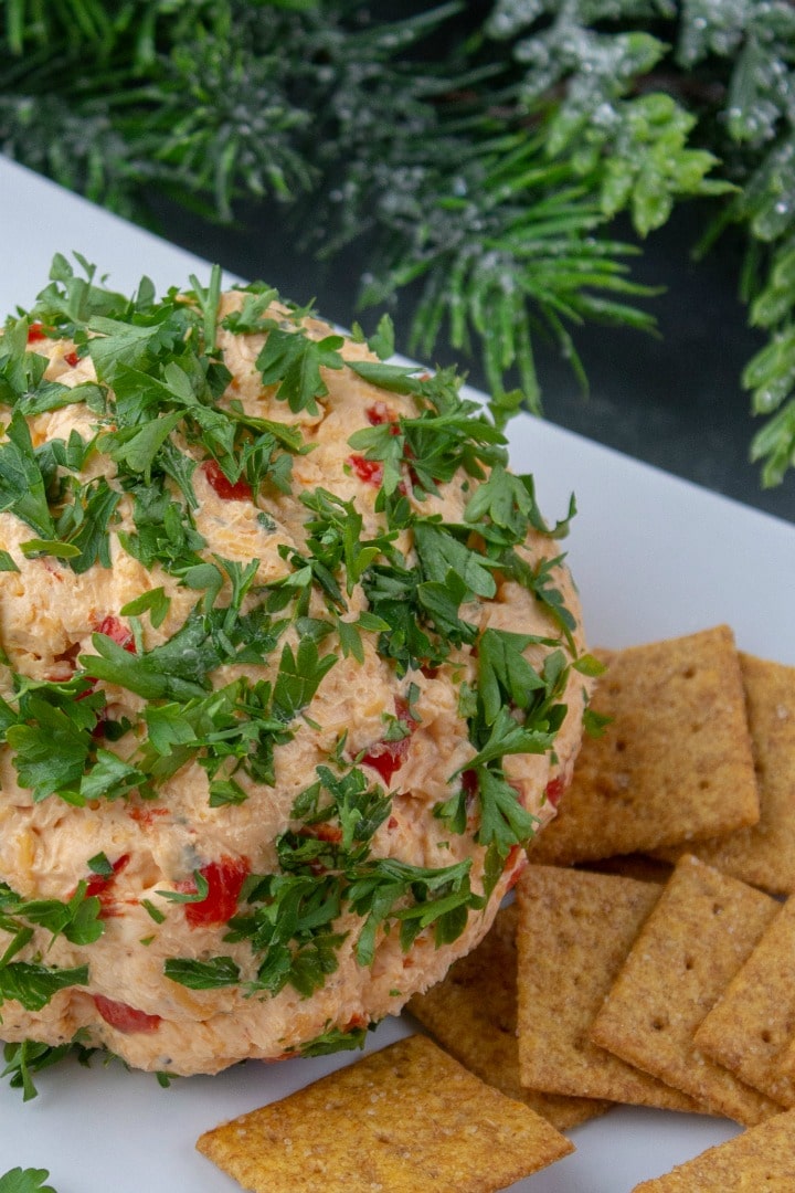 Try this festive Roasted Red Pepper Ranch Cheese Ball for your next gathering. Easy to make with only a handful of ingredients!