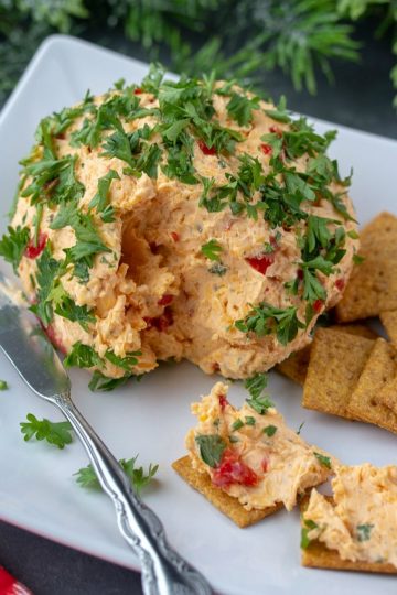 Try this festive Roasted Red Pepper Ranch Cheese Ball for your next gathering. Easy to make with only a handful of ingredients!